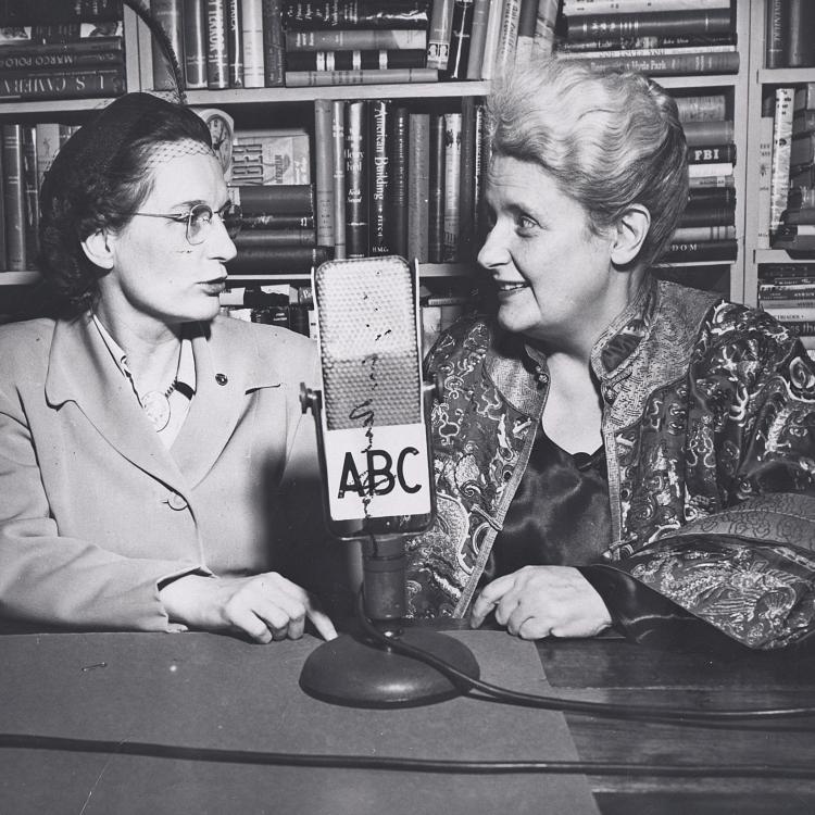 In this undated photograph, Mary Margaret McBride (right) interviews Goldena Howard, a local Missouri historian, during a broadcast from the University of Missouri library. [State Historical Society of Missouri, Mary Kathy Dains Photographs, P0300-014950]