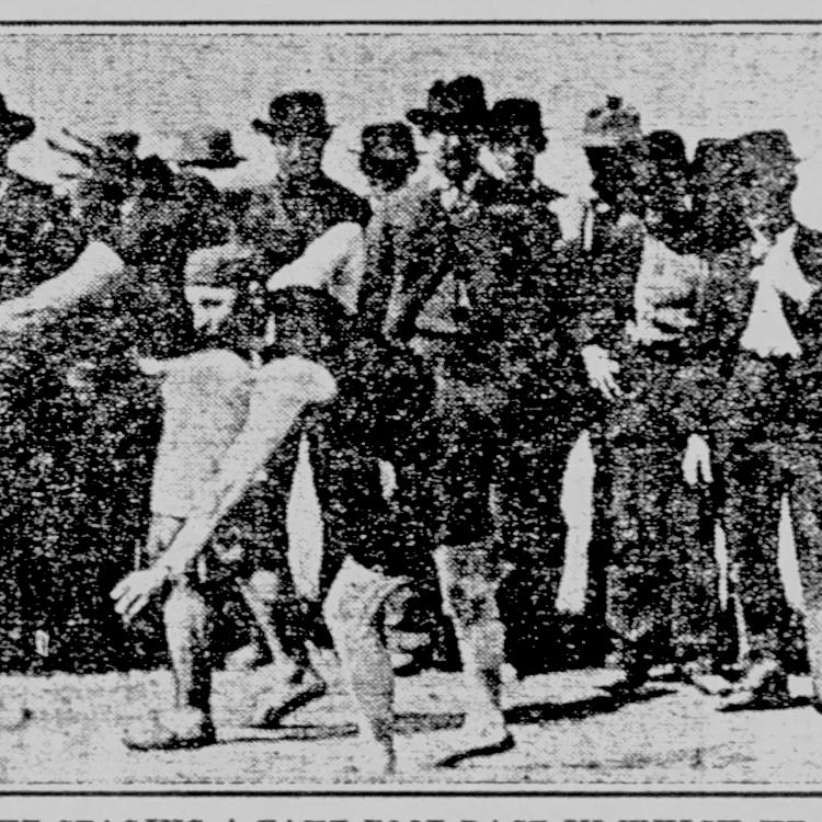 Robert P. W. Boatright, standing center with his hands in his pockets, with others gathered before a footrace at an unknown location circa 1900. [Sioux City (IA) Journal, June 4, 1911]