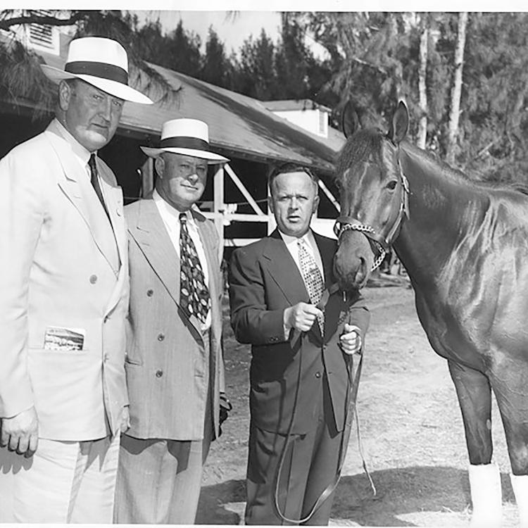 Citation is held by Jimmy Jones. Ben Jones and Captain Sir Charles Cecil Boyd-Rochefort stand to his left. This photo was taken at Hialeah Park in January 1949.  [Courtesy of the National Museum of Racing and Hall of Fame] 