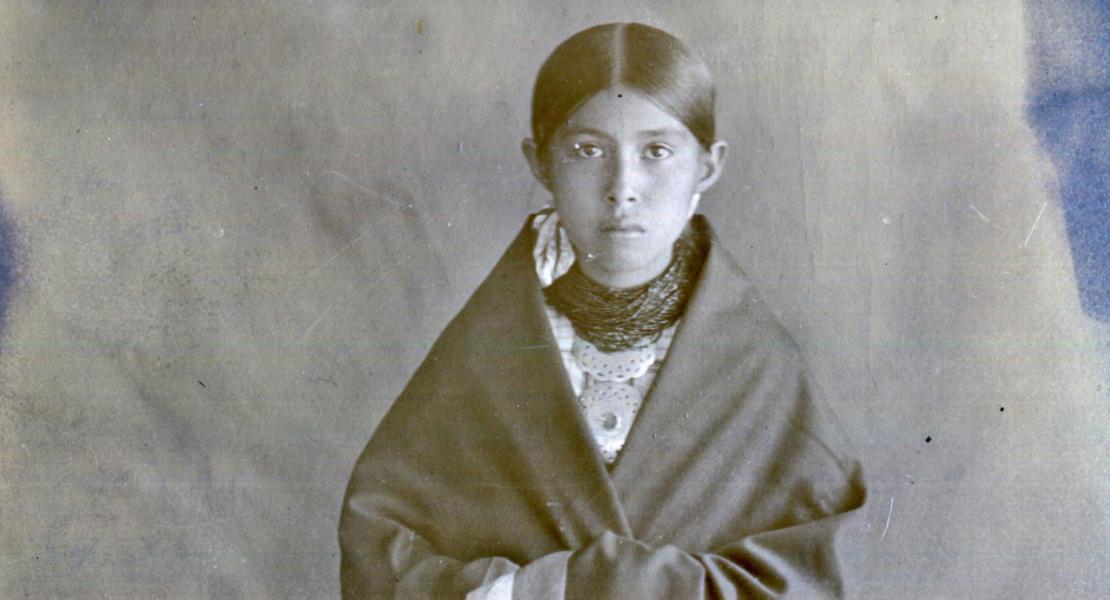 An Osage child in traditional clothing, circa 1910–1915. [Oklahoma Historical Society, Mat Duhr Collection, #3532] 