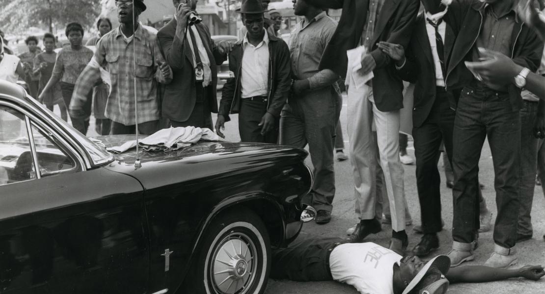 Ivory Perry blocking the path of a car during a protest against police brutality. Photograph by Lester Linck, © St. Louis Post-Dispatch. [Missouri Historical Society, St. Louis, St. Louis Post-Dispatch Collection, N22500]