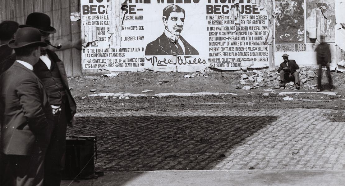Rolla Wells mayoral campaign poster at the northwest corner of Seventh and Cerre Streets in St. Louis. [Missouri Historical Society, St. Louis, Photographs and Prints Collection, N14699]