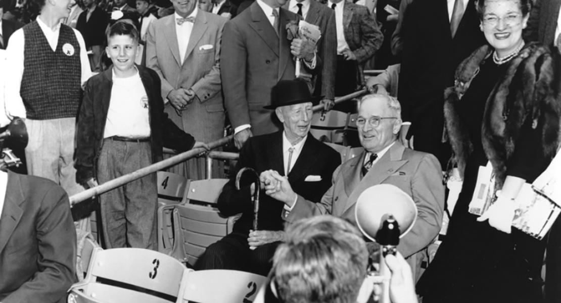 Harry S. Truman shakes hands with Connie Mack, owner and manager of the Athletics during their time in Philadelphia, at the A’s first game in Kansas City, April 12, 1955. [Harry S. Truman Library and Museum, 2007-379]