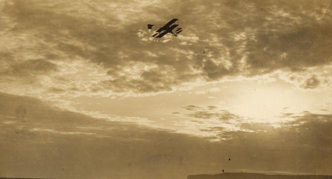 Hugh Robinson in flight over Point Loma, San Diego, California. [Courtesy of the California State Library]