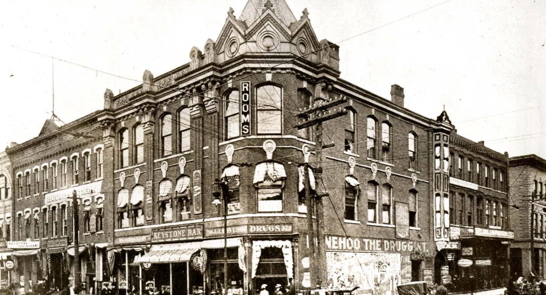 The Worth block at Fourth and Main in Joplin. Gilbert Barbee’s House of Lords can be seen at far left; the name of the building is painted between the second and third floors. [State Historical Society of Missouri, Whitaker Family Collection, SP0076-f010-003]