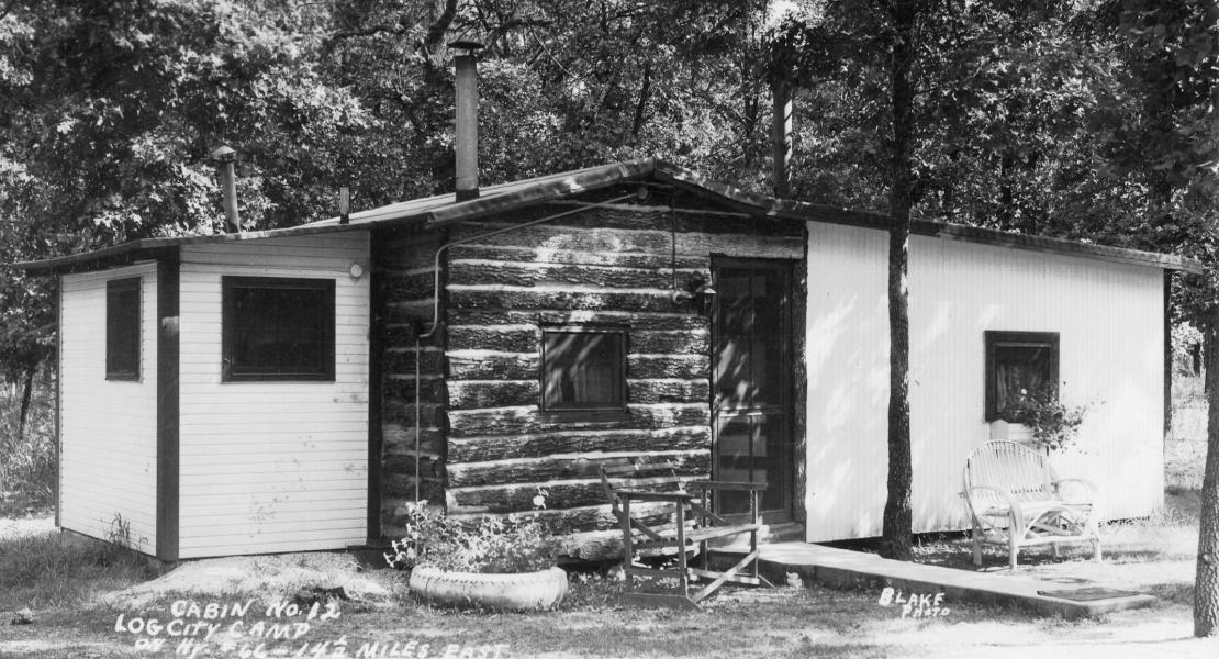 One of Log City’s cabins circa 1943. [State Historical Society of Missouri, John F. Bradbury Jr. Postcard Collection, R1551]