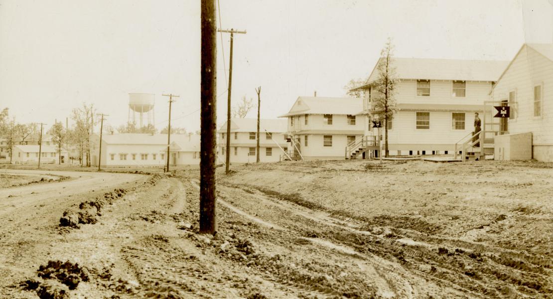 A view of muddy roads at Fort Leonard Wood. Some officers opted to stay at Pippin Place instead. [State Historical Society of Missouri, John F. Bradbury Jr. Postcard Collection, R1551]