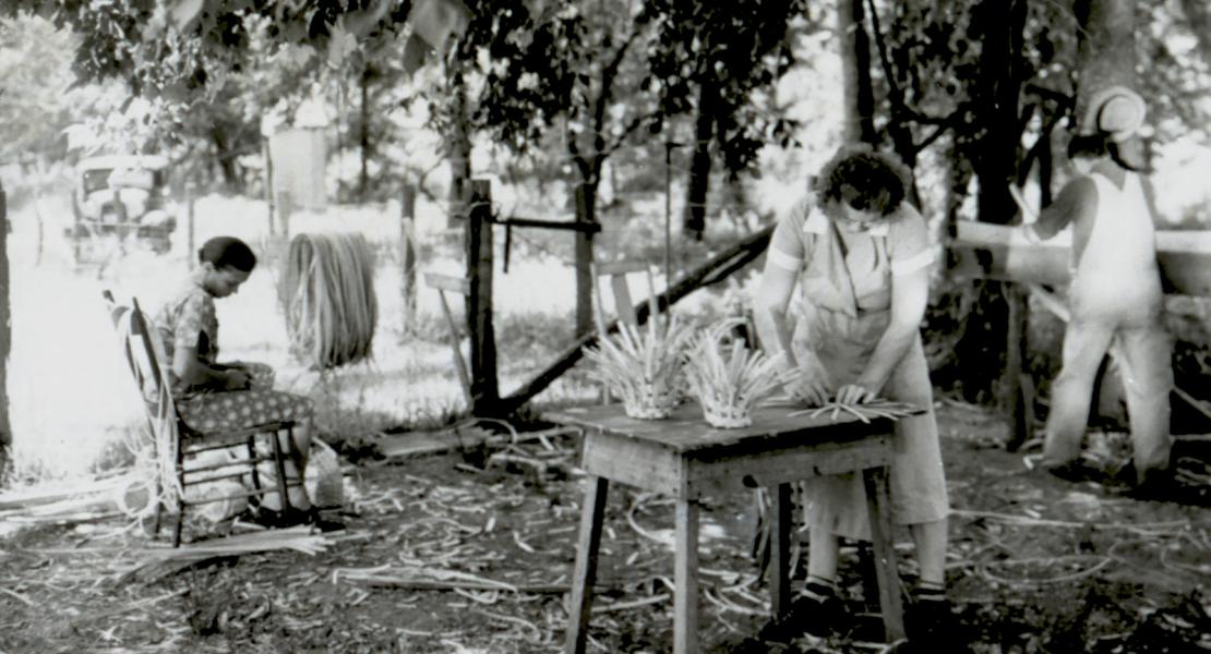 Another view of the Wells family’s outdoor “basket factory” at Hooker, Missouri, ca 1940. Left to right: Ruth Wells, Alice Wells, and Clarence Wells. [State Historical Society of Missouri, Mark Twain National Forest Local History Collection, R0471]