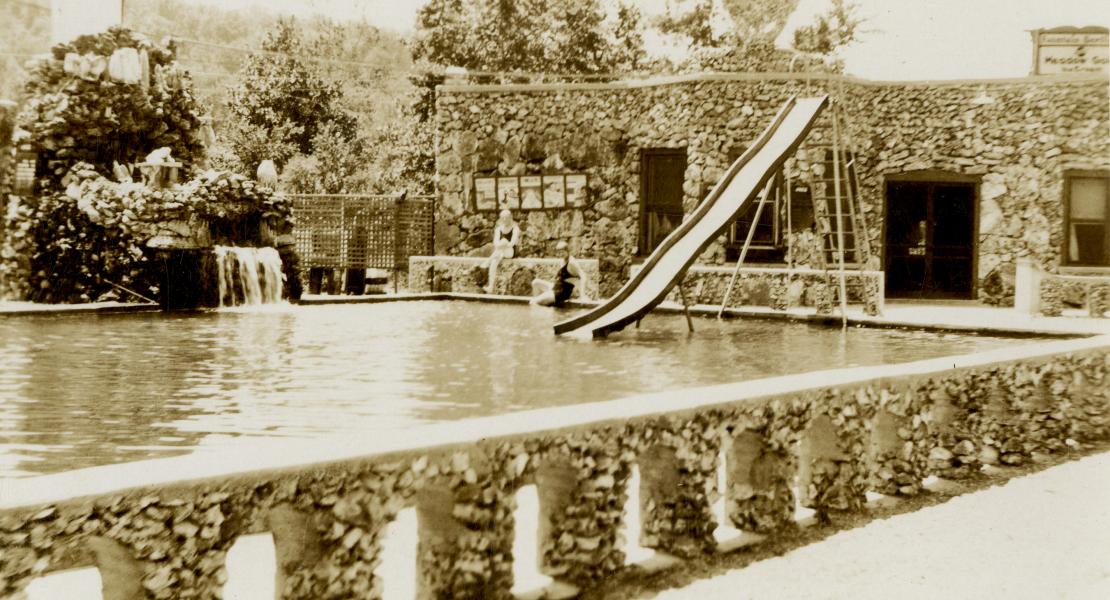 Water from artesian wells flowed up and out of a rock fountain visible at left. [State Historical Society of Missouri, John F. Bradbury Postcard Collection, R1551]