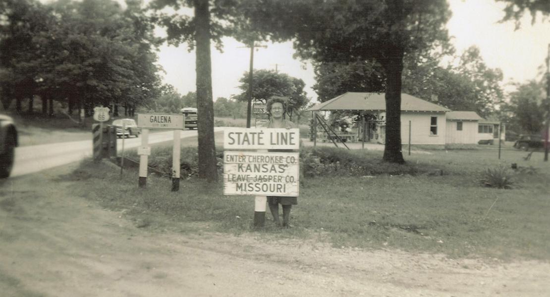 The Jasper County, Missouri/Cherokee County, Kansas state line sign. [Courtesy of the Galena Mining and Historical Museum, Galena, Kansas]