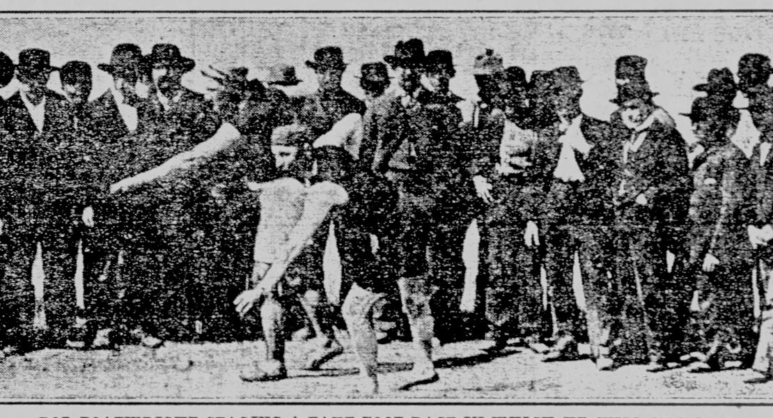 Robert P. W. Boatright, standing center with his hands in his pockets, with others gathered before a footrace at an unknown location circa 1900. [Sioux City (IA) Journal, June 4, 1911]